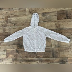 Fila white all over logo zip up windbreaker. Medium. Lightly worn.